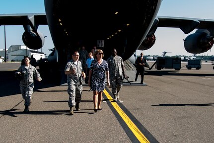 Secretary of the Air Force Deborah Lee James is escorted from a C-17 Globemaster III by Maj. Christopher Carmichael, 437th Aerial Port Squadron commander May 6, 2014, at Joint Base Charleston, S.C. James is the 23rd Secretary of the Air Force and was appointed to the position Dec. 20, 2013. She is responsible for the affairs of the Department of the Air Force, including organizing, training, equipping and providing for the welfare of its more than 690,000 active-duty, Guard, Reserve and civilian Airmen and their families. (U.S. Air Force photo/ Airman 1st Class Clayton Cupit)