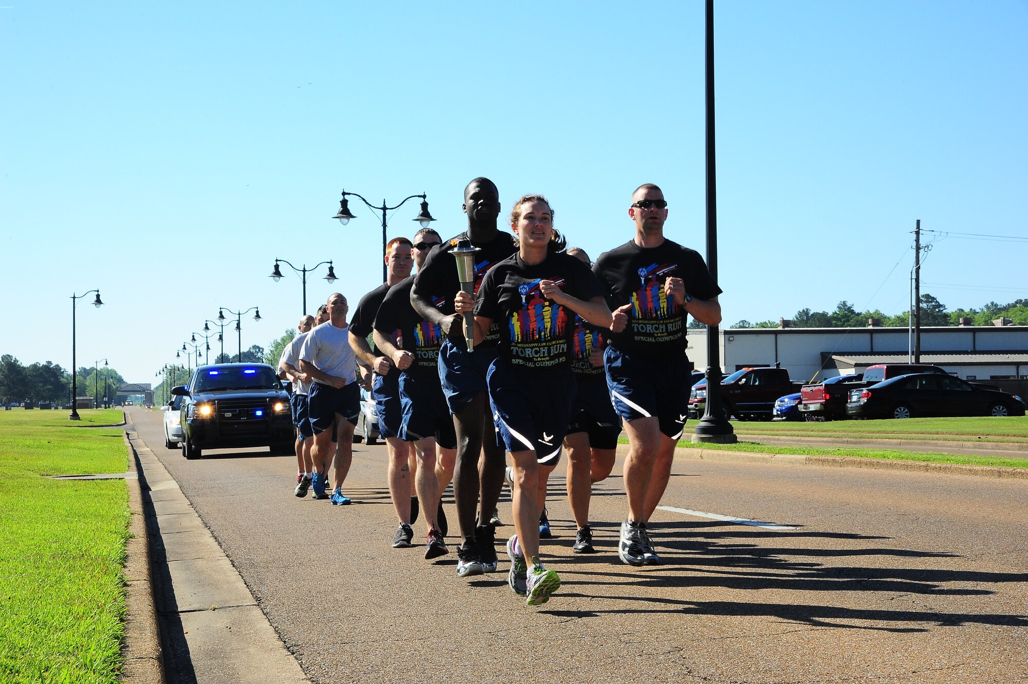 Capt. Laura Hansen, 14th Security Forces Squadron, leads the formation during a Torch Run May 6 for Law Enforcement Week. (U.S. Air Force Photo/Airman 1st Class Daniel Lile)