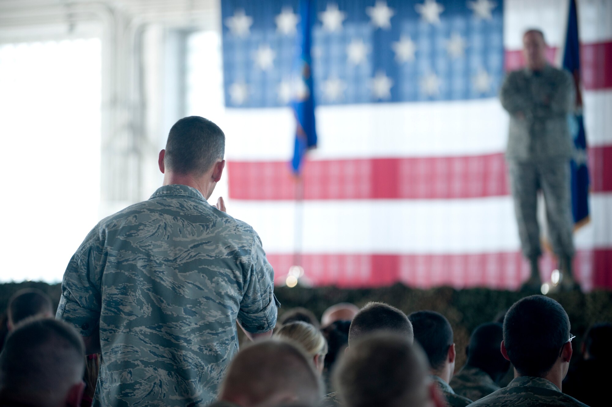 Maj. Kenneth Shinn, 366th Component Maintenance Squadron commander, asks Air Force Chief of Staff Mark A. Welsh III a question during a questions-and-answers session at an ‘all call’ at Mountain Home Air Force Base, Idaho, May 2, 2014. Welsh and his wife, Betty, visited the base and discussed current Air Force issues like force reductions. (U.S. Air Force photo by Airman 1st Class Malissa Lott/RELEASED)