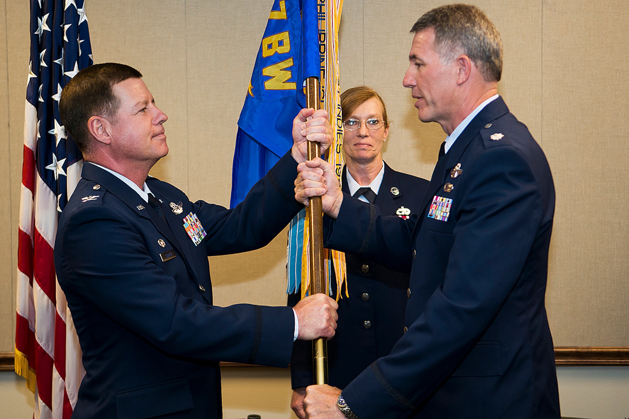 U.S. Air Force Col. Keith Schultz (left), 307th Operations Group commander, presents the 93rd Bomb Squadron (BS) guidon to Lt. Col. Robert Van Hoy II during a Change of Command ceremony, May 6, 2014, Barksdale Air Force Base, La. Van Hoy, the 93rd BS Director of Operations, assumed command of the 93rd BS. (U.S. Air Force photo by Master Sgt. Greg Steele/Released)