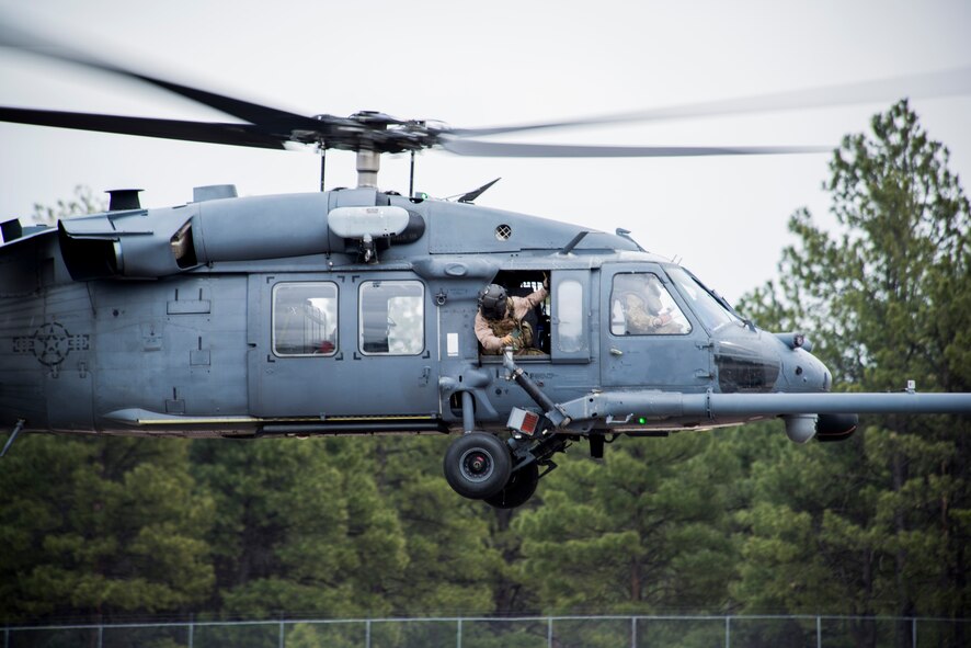 A U.S. Air Force HH-60G Pave Hawk from the 41st Rescue Squadron out of Moody Air Force Base, Ga., takes off at Flagstaff Pulliam Airport, Ariz., May 6, 2014, to take part in an Angel Thunder training mission. Angel Thunder is the largest and most realistic joint service, multinational, interagency combat search and rescue exercise designed to provide training for personnel recovery assets. (U.S. Air Force photo by Staff Sgt. Jamal D. Sutter/Released) 