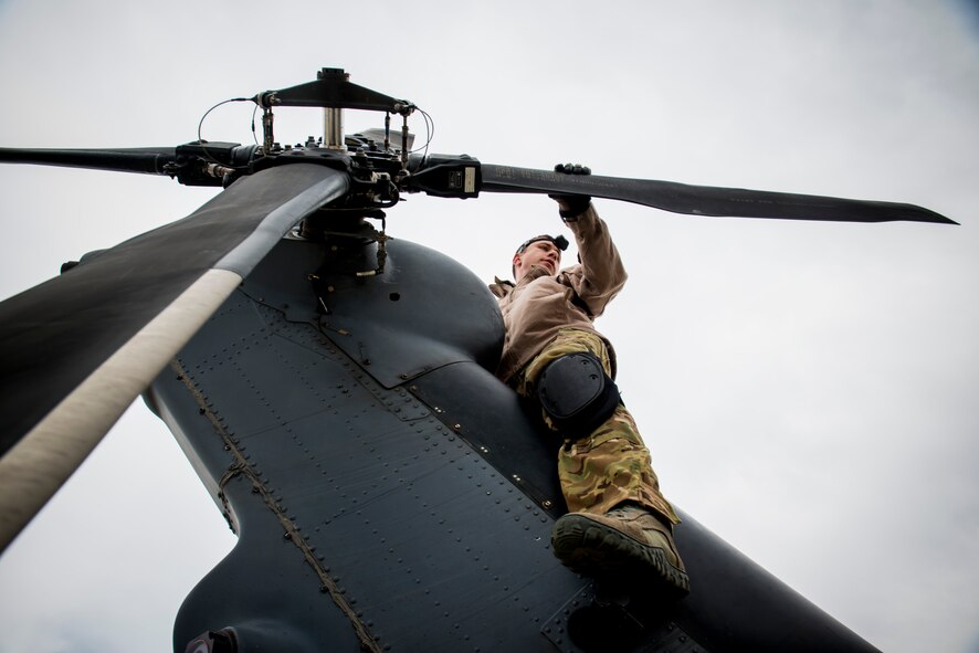 U.S. Air Force Tech. Sgt. Mathias Hauser, 41st Rescue Squadron special missions aviator out of Moody Air Force Base, Ga., inspects the rotor blades an HH-60G Pave Hawk May 6, 2014, at Flagstaff Pulliam Airport, Ariz. As a special missions aviator, one of Hauser’s responsibilities is to conduct preflight inspections to ensure the aircraft is mission ready. (U.S. Air Force photo by Staff Sgt. Jamal D. Sutter/Released) 