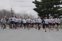 910th Airlift Wing members and family take off from the start line to begin a Wingman Day 5k fun run, here, May 2. Wingman Day is an annual Air Force Reserve Command requirement intended to improve morale and bolster a sense of community. U.S. Air Force photo by Tech. Sgt. Jim Brock.