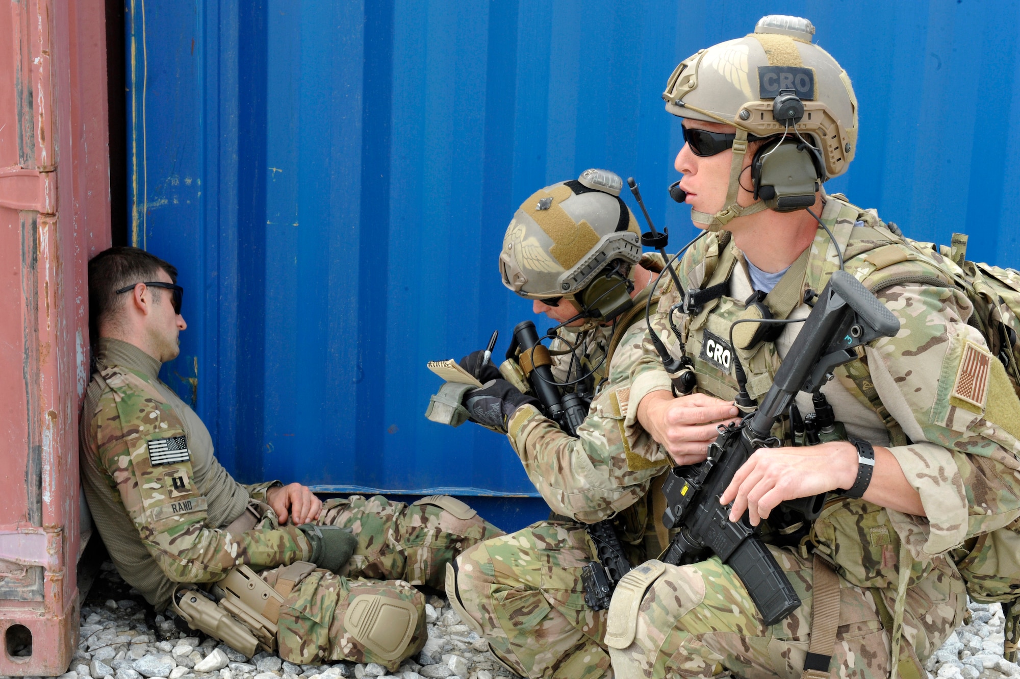 U.S. Army Captain William Rand simulates an injury as Air Force Master Sgt. Duane Hayes and 1st. Lt. Christopher Goetz, Air Force Pararescuemen from the 83rd Expeditionary Rescue Squadron, 455 Air Expeditionary Wing, Bagram Airfield, Afghanistan, provide care and cover during a training exercise here May 5, 2014. The scenario simulated a vehicle striking an Improvised Explosive Device. During the training, rescue crews flew on HH-60G Pave Hawks to the simulated point of injury, provided security, treated patients, prepared them for travel, and safely departed the area. Hayes and Goetz are deployed from Moody Air Force Base, Ga.  (U.S. Air Force photo by Maj. Brandon Lingle/Released)