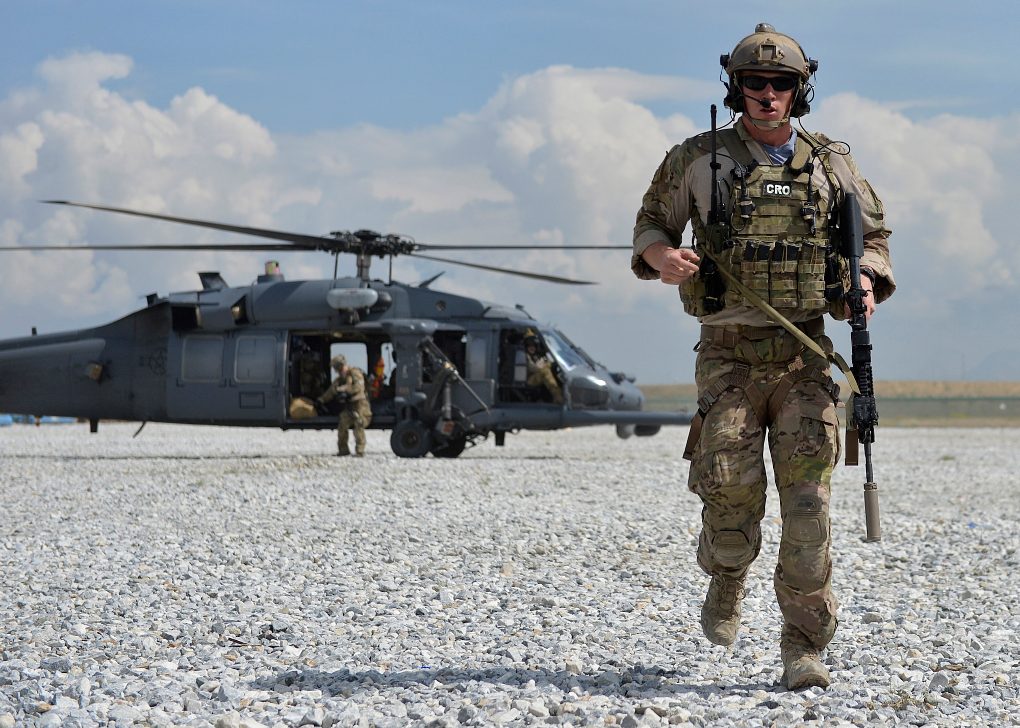 U.S. Air Force 1st Lt. Christopher Goetz, 83rd Expeditionary Rescue Squadron Combat Rescue Officer, walks away from a HH-60 Pave Hawk helicopter during a training scenario at Bagram Airfield, Afghanistan May 5, 2014.  During the training, rescue crews flew on HH-60G Pave Hawks to the simulated point of injury, provided security, treated patients, prepared them for travel, and safely departed the area.  Goetz is deployed from Moody Air Force Base, Ga. (U.S. Air Force photo by Staff Sgt. Evelyn Chavez/Released)