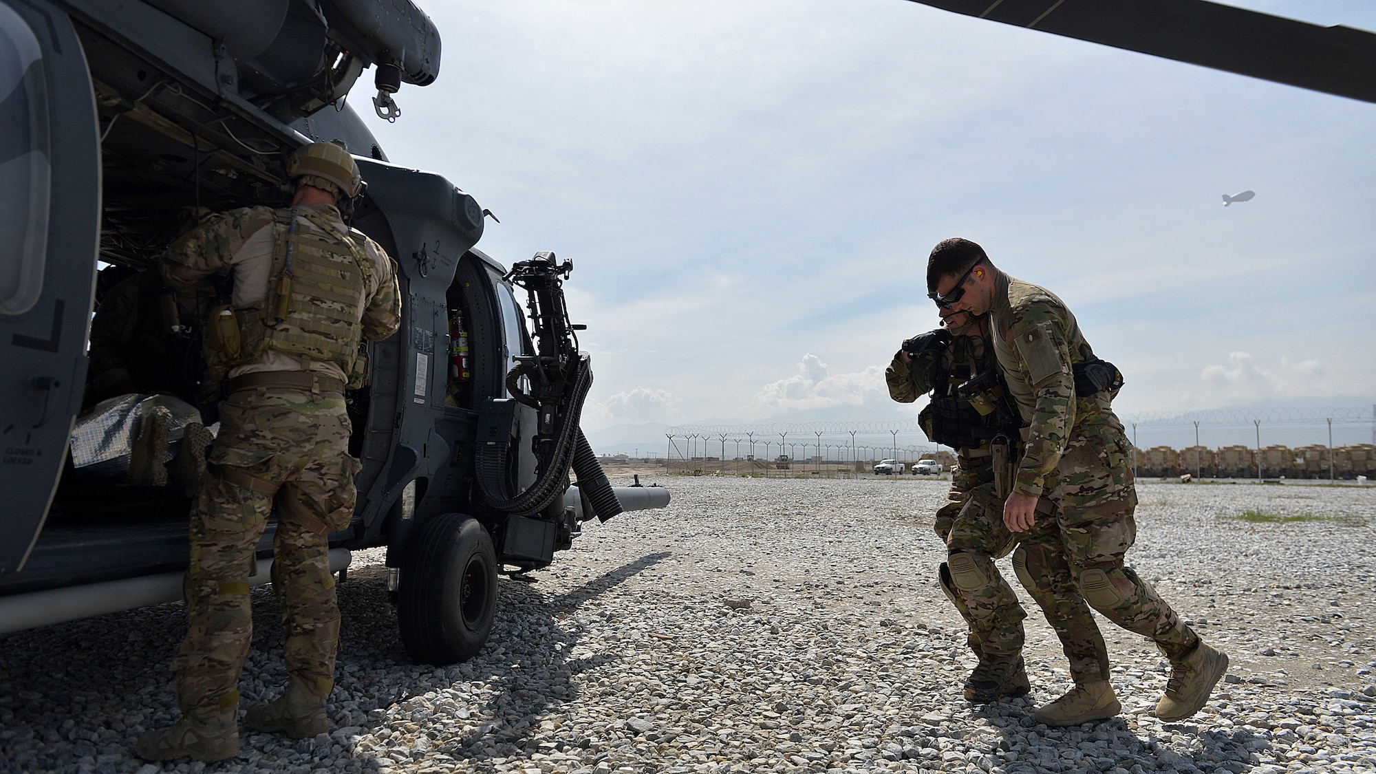 Air Force Pararescuemen from the 83rd Expeditionary Rescue Squadron, 455 Air Expeditionary Wing, Bagram Airfield, Afghanistan, help a simulated patient to a HH-60G Pave Hawk helicopter during a training exercise May 5, 2014. The scenario simulated a vehicle striking an Improvised Explosive Device. During the training, rescue crews flew on HH-60G Pave Hawks to the simulated point of injury, provided security, treated patients, prepared them for travel, and safely departed the area.  PJ’s perform life-saving missions and provide emergency medical capabilities in humanitarian and combat operations. (U.S. Air Force photo by Staff Sgt. Evelyn Chavez/Released) 