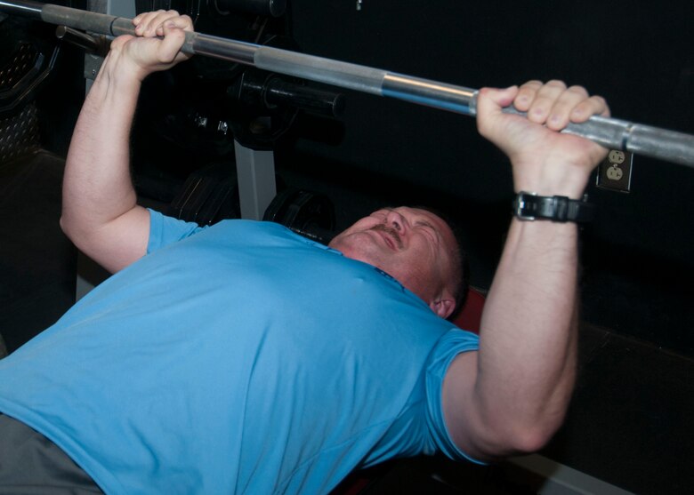 Jeremi Mahaffey, 3rd Space Experimentation Squadron, lifts a barbell during the Schriever Combine May 2, 2014, at the base fitness center. The combine kicked off fitness month’s events. (U.S. Air Force photo/Senior Airman Naomi Griego)