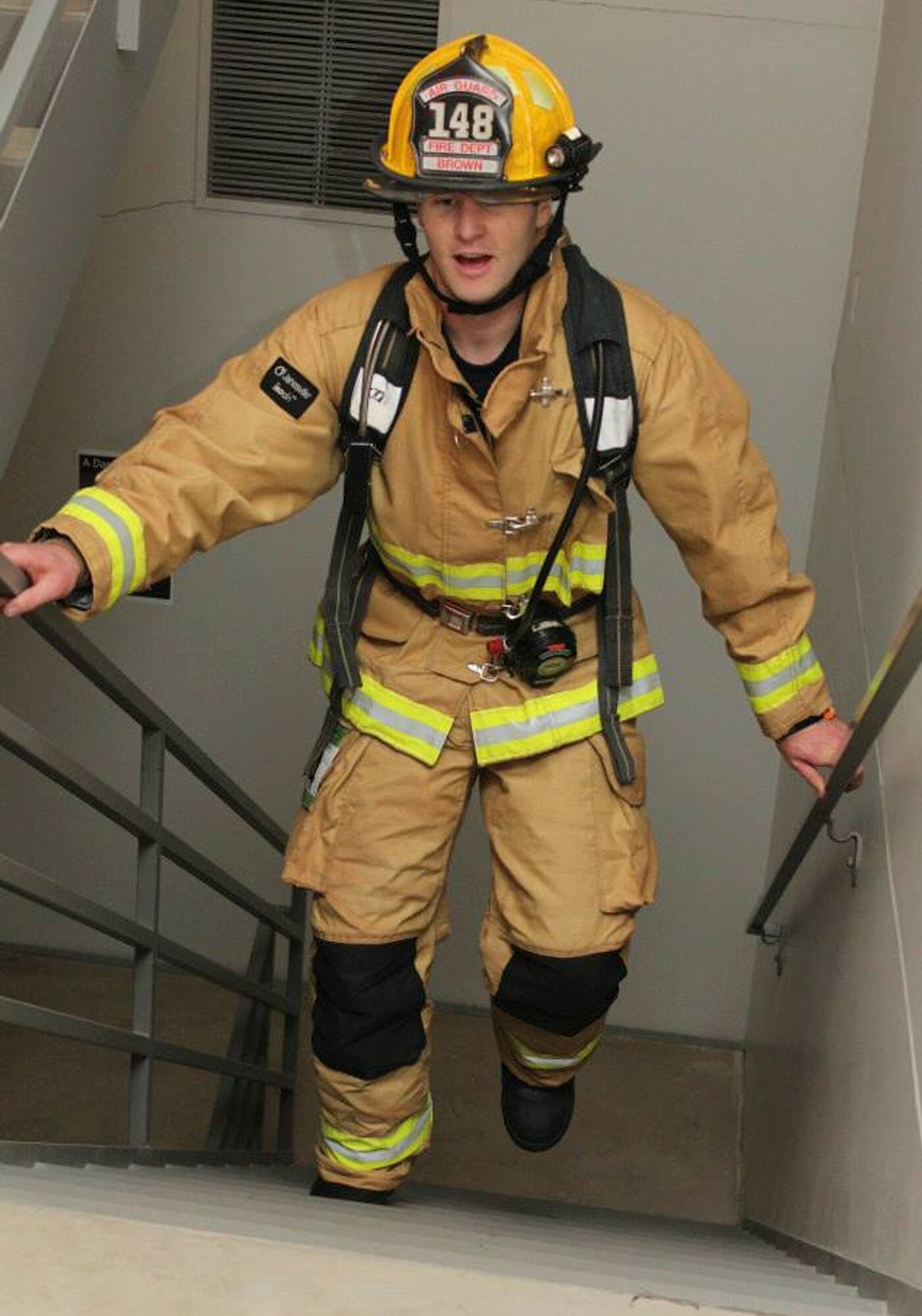 Staff Sgt. Nathan Brown, 148th Fighter Wing, Duluth, Minn. climbs stairs for charity April 5, 2014.  Staff Sgt. Brown and other 148th Fighter Wing firefighters participated in Big Climb-Minneapolis to help raise money for the Leukemia and Lymphoma Society.  (Courtesy Photo)