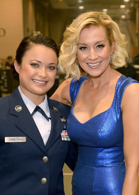 Air Force Staff Sgt. Baily Zimmerman, an aircrew aerospace medical craftsman assigned to the 43rd Aeromedical Evacuation Squadron, Pope Army Airfield, Fort Bragg, N.C., left, and recording artist Kellie Pickler attend ACM Presents: An All-Star Salute To The Troops at the MGM Grand Garden Arena on April 7, 2014 in Las Vegas, Nevada. Sergeant Zimmerman's hometown is Ottoville, Ohio. (Getty Images/ Courtesy of Academy of Country Music)