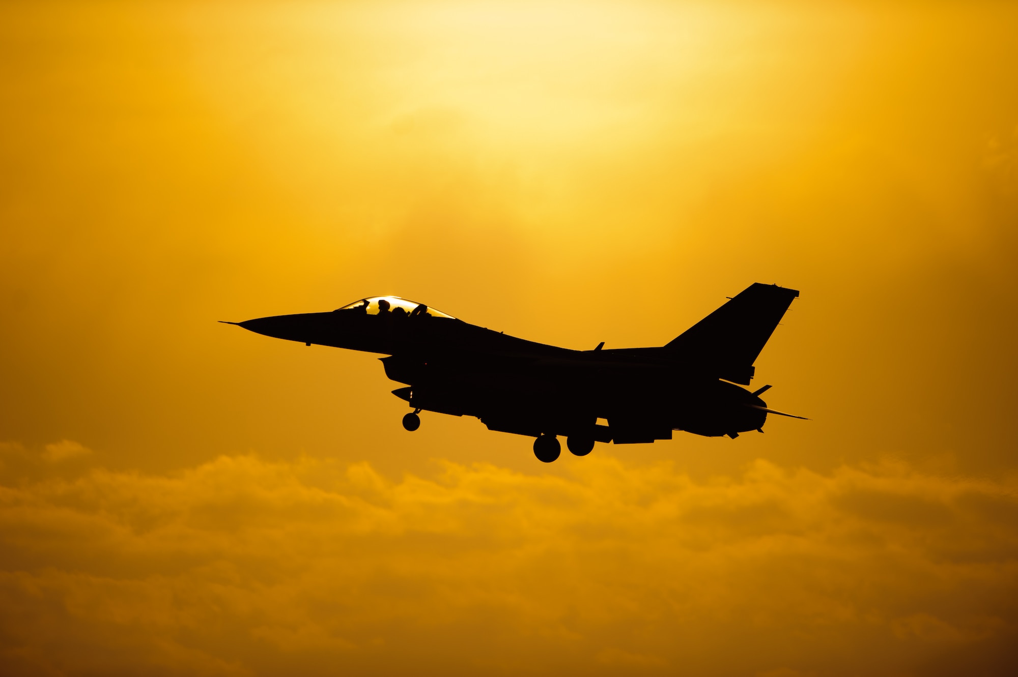 An 80th Fighter Squadron pilot comes in for a sunset landing after completing a sortie at Kunsan Air Base, Republic of Korea, May 7, 2014. Beverly Bulldog 14-2 tested Kunsan’s ability to tackle obstacles on the ground and air to ensure continued operations. (U.S. Air Force photo by Senior Airman Armando A. Schwier-Morales/Released)