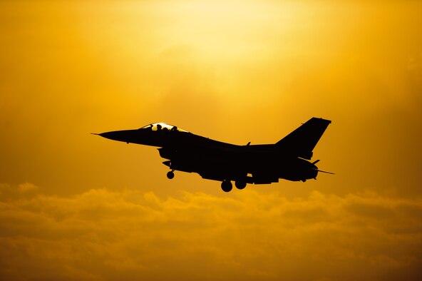 An 80th Fighter Squadron pilot comes in for a sunset landing after completing a sortie at Kunsan Air Base, Republic of Korea, May 7, 2014. Beverly Bulldog 14-2 tested Kunsan’s ability to tackle obstacles on the ground and air to ensure continued operations. (U.S. Air Force photo by Senior Airman Armando A. Schwier-Morales/Released)