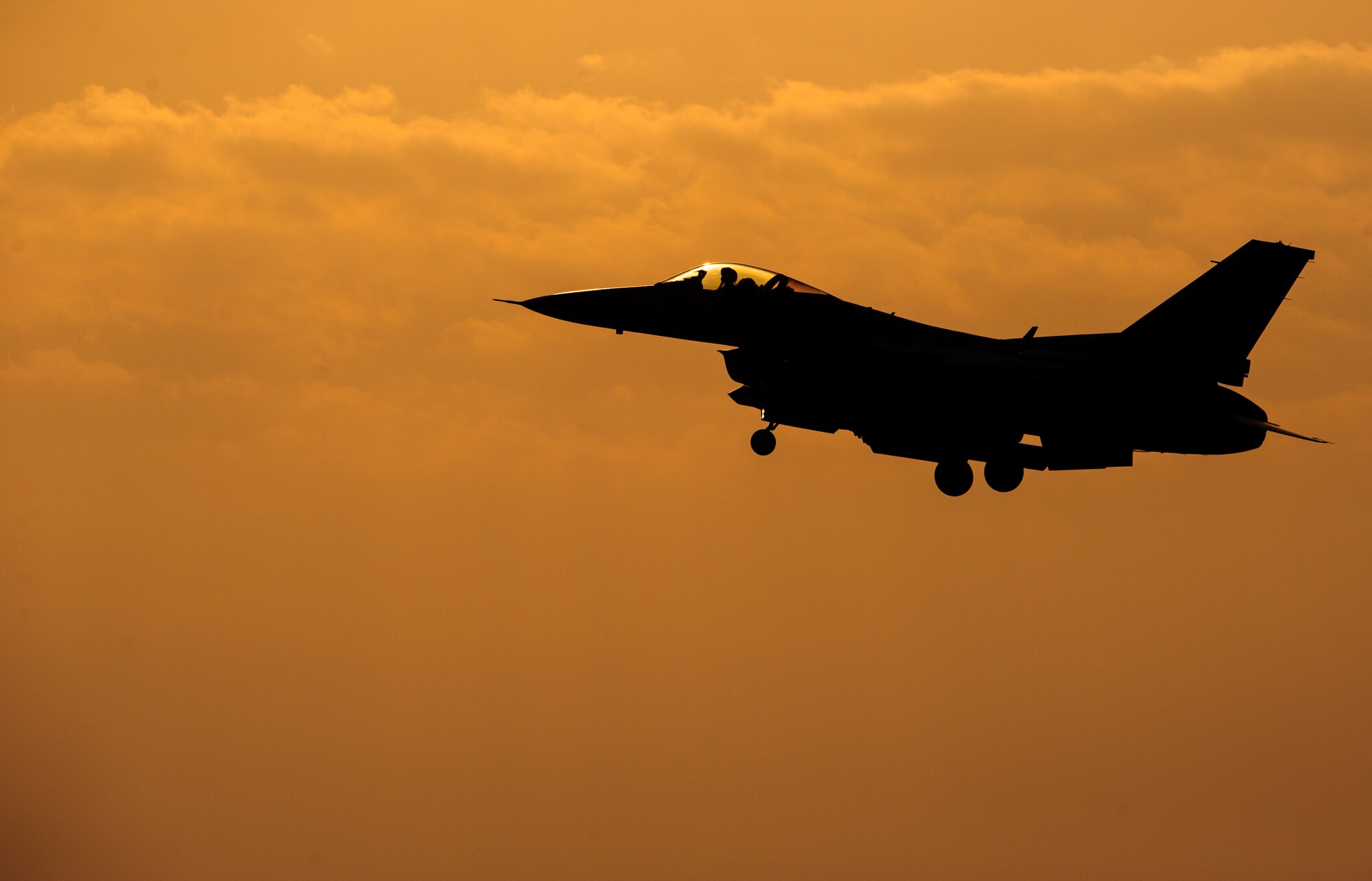 An 80th Fighter Squadron pilot comes in for a sunset landing after completing a sortie at Kunsan Air Base, Republic of Korea, May 7, 2014. Beverly Bulldog 14-2 tested Kunsan’s ability to tackle obstacles on the ground and air to ensure continued operations. (U.S. Air Force photo by Senior Airman Armando A. Schwier-Morales/Released)