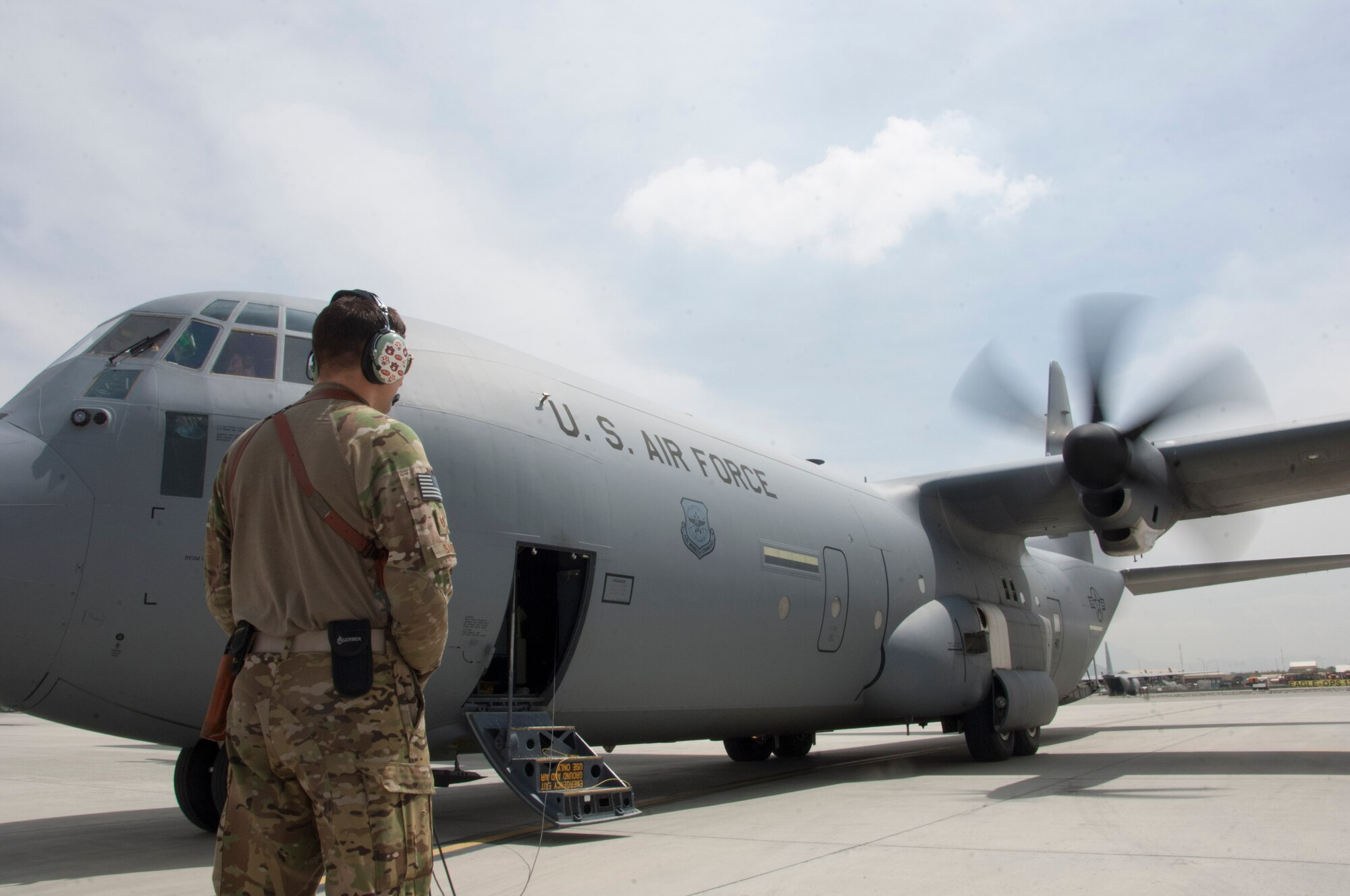 KABUL INTERNATIONAL AIRPORT, Afghanistan - U.S. Air Force Tech. Sgt. Thomas Baker, a loadmaster assigned to the 774th Expeditionary Airlift Squadron, 455th Air Expeditionary Wing goes through pre-check procedures on a C-130 J-30 at Kabul International Airport May 5, 2014. Baker, a native of Hamilton, Ala. was preparing for a flight to Fayzabad Airport as Coalition Forces joined together to assist the Afghan Government with relief efforts after a recent mudslide in Badakhshan province. (U.S. Air Force photo by Master Sgt. Cohen A. Young)