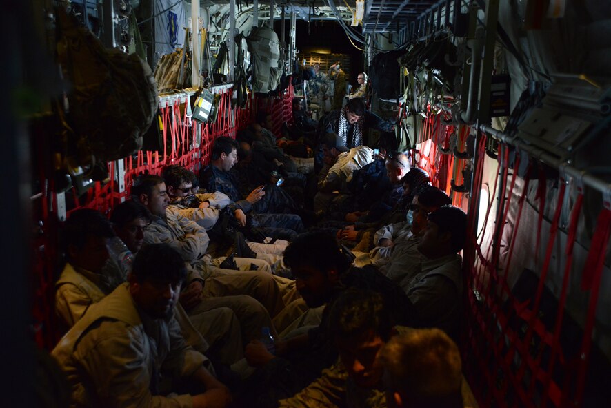 Afghan National Army soldiers and advisers fly aboard a C-130J Super Hercules assigned to the 774th Expeditionary Airlift Squadron May 5, 2014. The team was flown to Fayzabad Airport by coalition forces so they could make their way to the Badakhshan province, which experienced a mudslide May 2. The mudslide is responsible for the loss of lives and damage to a village. (U.S. Air Force photo by Master Sgt. Cohen A. Young/Released)