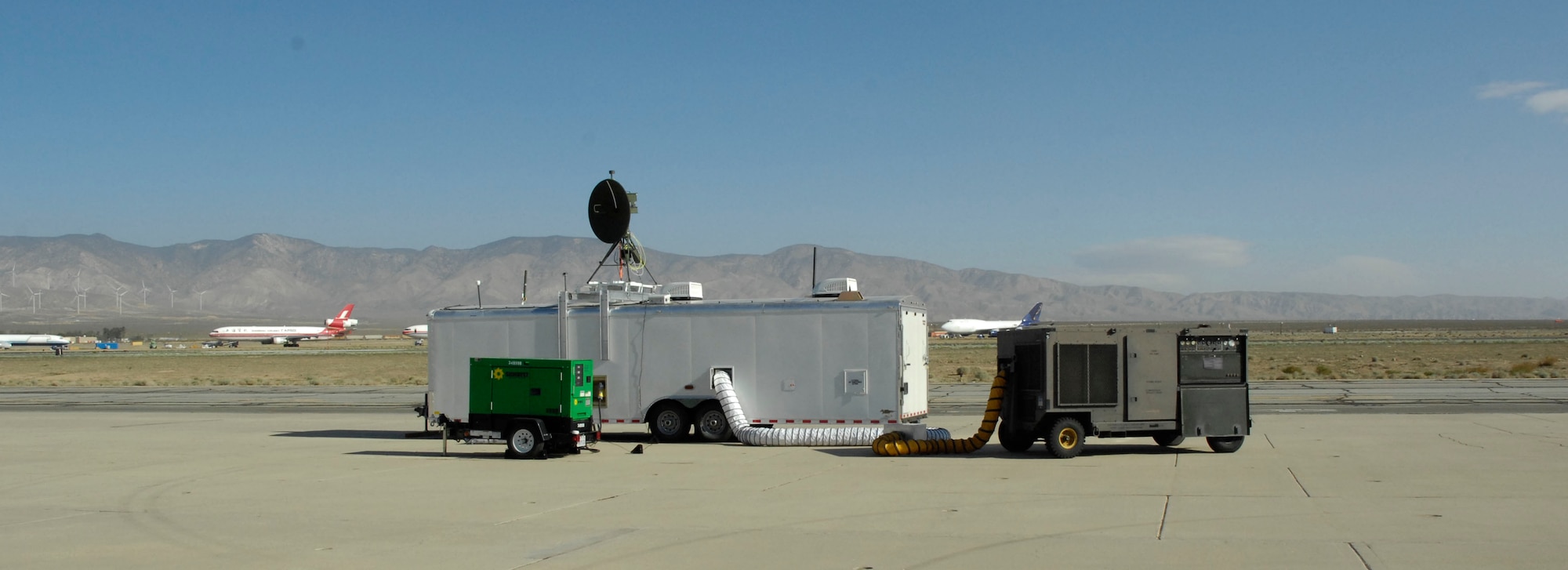A Dismount Detection Radar command and control station operates on the flightline at the Mojave Airport Civilian Flight Test Center April 22, 2014. The station was able to view feedback from the radar in real time during the system's first developmental test flight. The DDR team, a Life Cycle Management Center program office, developed a new C2 station within three months for the radar. (U.S. Air Force photo by 1st Lt. Matthew Cook)