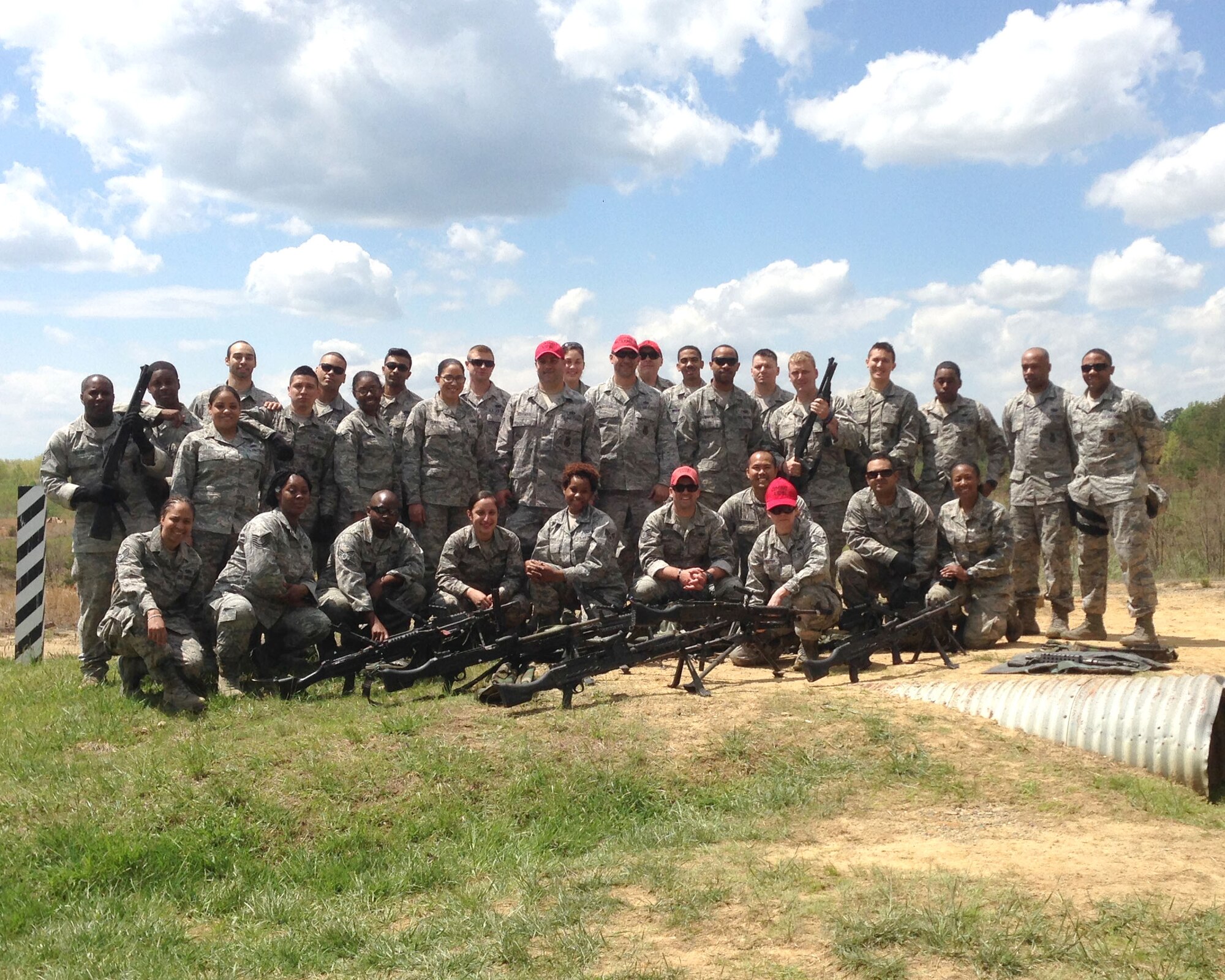 The 459th Security Forces Squadron at Joint Base Andrews, Md., pose for a picture after conducting heavy weapons training at Marine Base Quantico, Virginia, May 3, 2014. The qualifications fulfills annual readiness requirements in order to provide air base ground defense to combatant commanders. (U.S. Air Force photo)