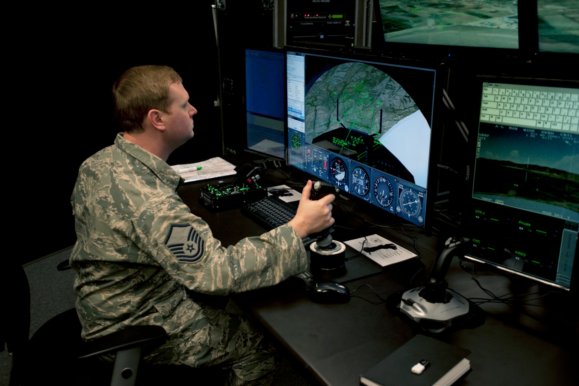 A member of the 146th Air Support Operations Squadron (ASOS), participates in training utilizing the Air National Guard Advanced Joint Terminal Attack Controller Training System (AAJTS) to Brig. Gen. Hopper Smith, assistant adjutant general-Army for the Oklahoma National Guard, during an unveiling of the first operational AAJTS in the nation at Will Rogers Air National Guard Base in Oklahoma City. The AAJTS is a high-fidelity, fully immersive, simulator designed to support Air National Guard (ANG) Joint Terminal Attack Controller (JTAC) and Combat Controller squadron level continuation, qualification and mission rehearsal training. The AAJTS system encompasses high fidelity visual displays, geo-specific visual data bases, equipment emulators, and associated hardware and software. The AAJTS is designed to meet the requirements for unit training at Air Support Operations Squadrons (ASOS) and Special Tactics Squadrons (STS).
PHOTO: Maj. Geoff Legler, Oklahoma National Guard Public 