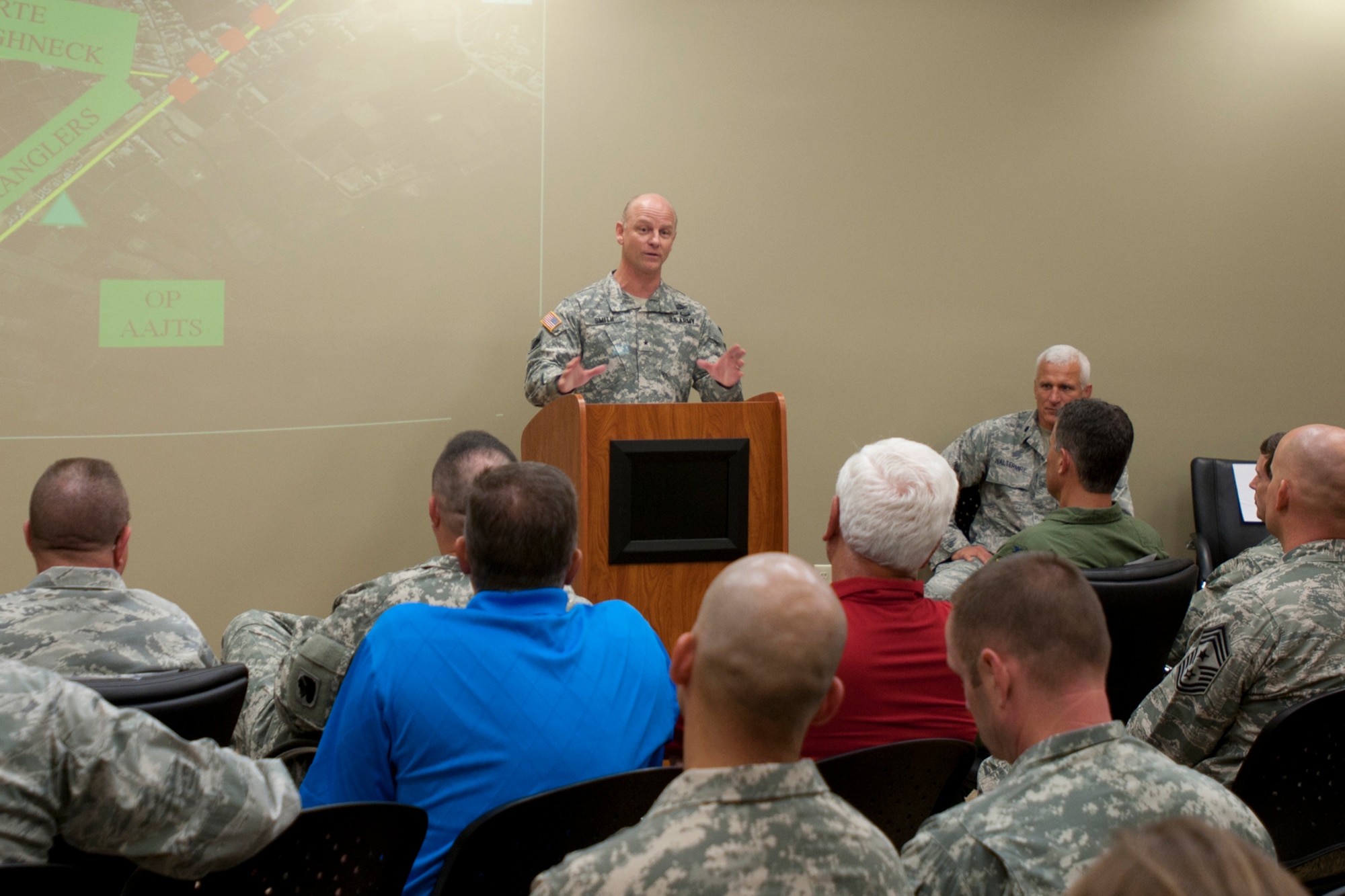 A member of the 146th Air Support Operations Squadron (ASOS), participates in training utilizing the Air National Guard Advanced Joint Terminal Attack Controller Training System (AAJTS) to Brig. Gen. Hopper Smith, assistant adjutant general-Army for the Oklahoma National Guard, during an unveiling of the first operational AAJTS in the nation at Will Rogers Air National Guard Base in Oklahoma City. The AAJTS is a high-fidelity, fully immersive, simulator designed to support Air National Guard (ANG) Joint Terminal Attack Controller (JTAC) and Combat Controller squadron level continuation, qualification and mission rehearsal training. The AAJTS system encompasses high fidelity visual displays, geo-specific visual data bases, equipment emulators, and associated hardware and software. The AAJTS is designed to meet the requirements for unit training at Air Support Operations Squadrons (ASOS) and Special Tactics Squadrons (STS).
PHOTO: Maj. Geoff Legler, Oklahoma National Guard Public 