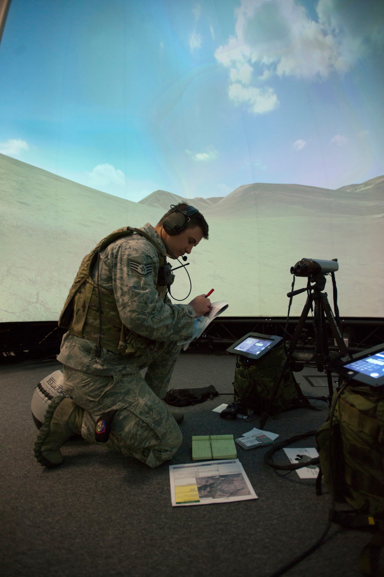 A member of the 146th Air Support Operations Squadron (ASOS), participates in training utilizing the Air National Guard Advanced Joint Terminal Attack Controller Training System (AAJTS) to Brig. Gen. Hopper Smith, assistant adjutant general-Army for the Oklahoma National Guard, during an unveiling of the first operational AAJTS in the nation at Will Rogers Air National Guard Base in Oklahoma City. The AAJTS is a high-fidelity, fully immersive, simulator designed to support Air National Guard (ANG) Joint Terminal Attack Controller (JTAC) and Combat Controller squadron level continuation, qualification and mission rehearsal training. The AAJTS system encompasses high fidelity visual displays, geo-specific visual data bases, equipment emulators, and associated hardware and software. The AAJTS is designed to meet the requirements for unit training at Air Support Operations Squadrons (ASOS) and Special Tactics Squadrons (STS).
PHOTO: Maj. Geoff Legler, Oklahoma National Guard Public 