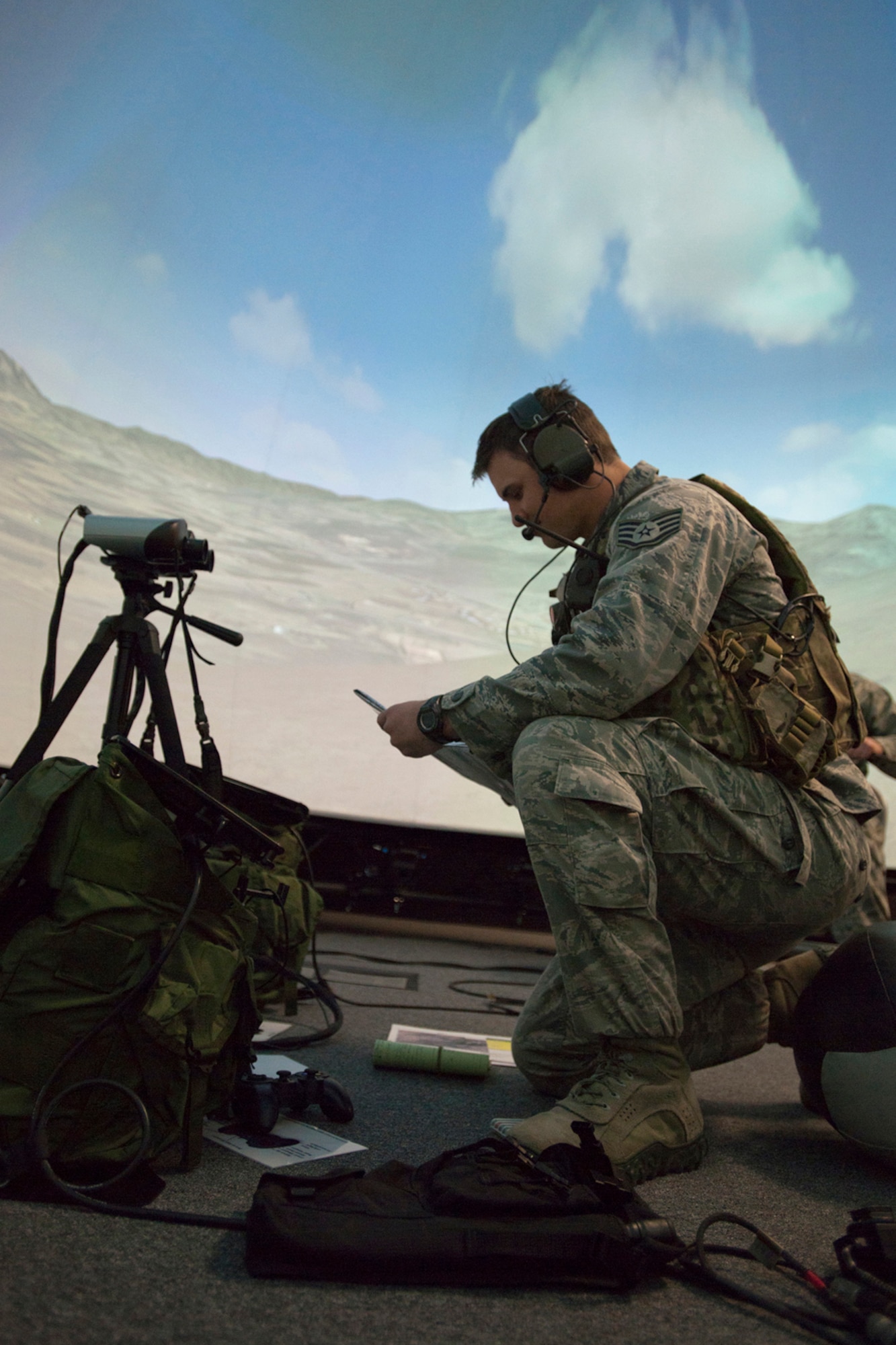 A member of the 146th Air Support Operations Squadron (ASOS), participates in training utilizing the Air National Guard Advanced Joint Terminal Attack Controller Training System (AAJTS) to Brig. Gen. Hopper Smith, assistant adjutant general-Army for the Oklahoma National Guard, during an unveiling of the first operational AAJTS in the nation at Will Rogers Air National Guard Base in Oklahoma City. The AAJTS is a high-fidelity, fully immersive, simulator designed to support Air National Guard (ANG) Joint Terminal Attack Controller (JTAC) and Combat Controller squadron level continuation, qualification and mission rehearsal training. The AAJTS system encompasses high fidelity visual displays, geo-specific visual data bases, equipment emulators, and associated hardware and software. The AAJTS is designed to meet the requirements for unit training at Air Support Operations Squadrons (ASOS) and Special Tactics Squadrons (STS).
PHOTO: Maj. Geoff Legler, Oklahoma National Guard Public 