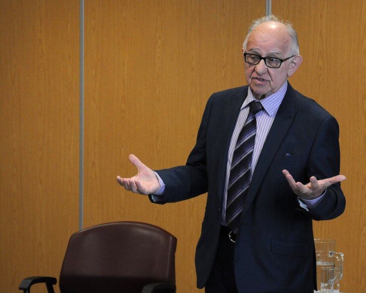 Zigi Shipper, a holocaust survivor, shares his experiences with Team Mildenhall members April 30, 2014, in the base chapel on RAF Mildenhall, England. Shipper was born to Orthodox Jewish parents in Poland in 1930 and spent many years in ghettos and concentration camps during World War II. When the war broke out, Shipper’s father escaped to Russia, believing that only young Jewish men were at risk, and not children or the elderly. Shipper never saw his father again and still does not know what happened to him. (U.S. Air Force photo by Gina Randall/Released)