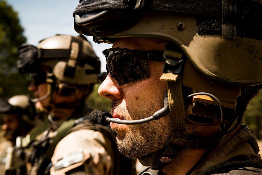A member of the Swiss army listens in on a mission brief May 5, 2014, at Camp Navajo, Ariz., in part of Angel Thunder. During the exercise, the Swiss soldier will partner with Airmen from the 58th Rescue Squadron to conduct various personnel recovery training missions and scenarios. (U.S. Air Force photo by Staff. Sgt. Jamal D. Sutter/Released) 