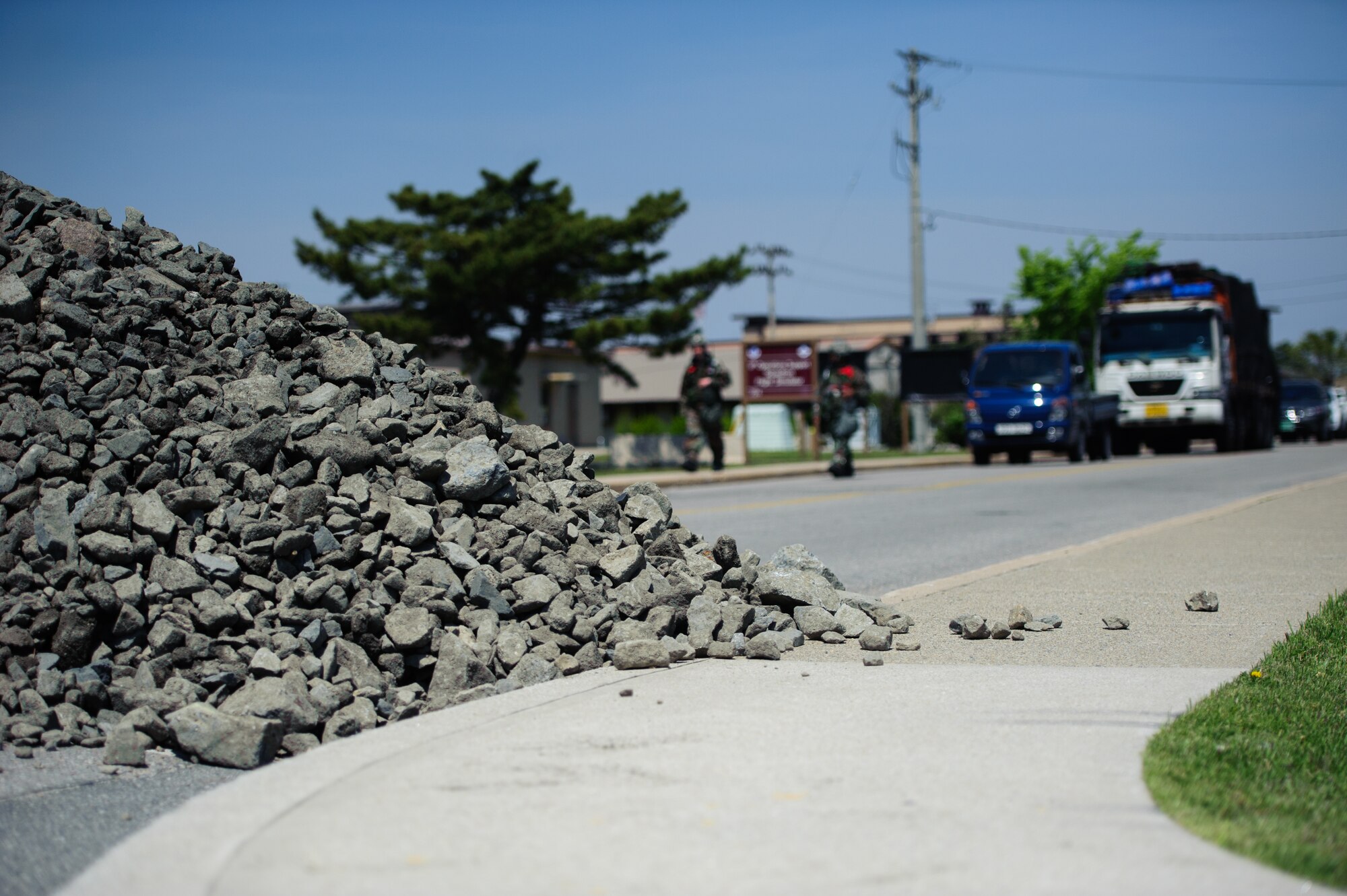 Two wing inspection team members review reactions to the rubble left by a simulated missile attack at Kunsan Air Base, Republic of Korea, May 7, 2014. The Wolf Pack continued to prove its combat readiness as they entered the third day of the peninsula-wide operational readiness exercise. (U.S. Air Force photo by Senior Airman Armando A. Schwier-Morales/Released)