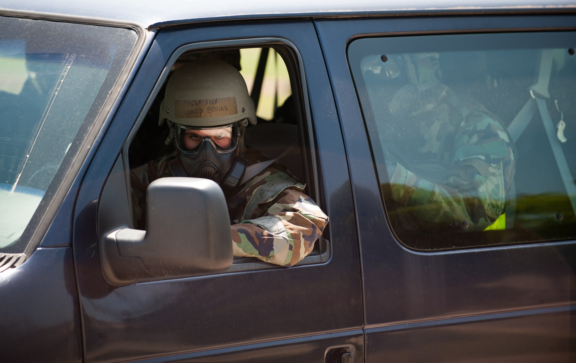 First Lt. David Bohan, 8th Logistics Readiness Squadron fuels management flight commander, awaits passengers for an evacuation during exercise Beverly Bulldog 14-2 at Kunsan Air Base, Republic of Korea, May 7, 2014. The Wolf Pack continued to prove its combat readiness as they entered the third day of the peninsula-wide operational readiness exercise. (U.S. Air Force photo by Staff Sgt. Clayton Lenhardt/Released)