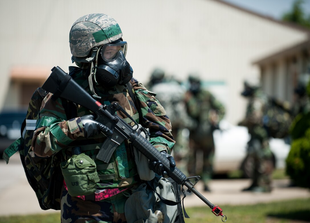 Staff Sgt. Mary Carter, 8th Civil Engineer Squadron construction inspector, stands guard for an evacuation during exercise Beverly Bulldog 14-2 at Kunsan Air Base, Republic of Korea, May 7, 2014. The Wolf Pack continued to prove its combat readiness as they entered the third day of the peninsula-wide operational readiness exercise. (U.S. Air Force photo by Staff Sgt. Clayton Lenhardt/Released)