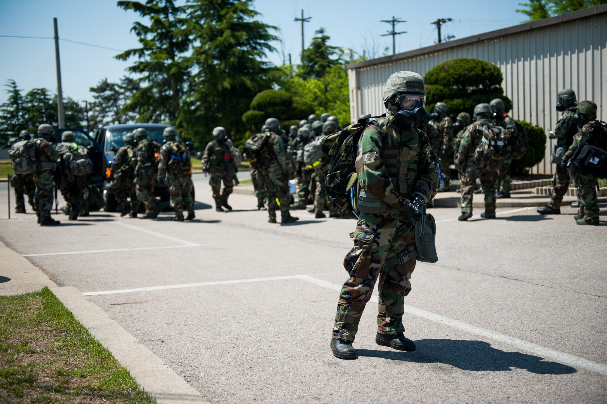 First Lt. Angela Etapa, 8th Civil Engineer Squadron chief of design, stands guard for an evacuation during exercise Beverly Bulldog 14-2 at Kunsan Air Base, Republic of Korea, May 7, 2014. The Wolf Pack continued to prove its combat readiness as they entered the third day of the peninsula-wide operational readiness exercise. (U.S. Air Force photo by Staff Sgt. Clayton Lenhardt/Released)