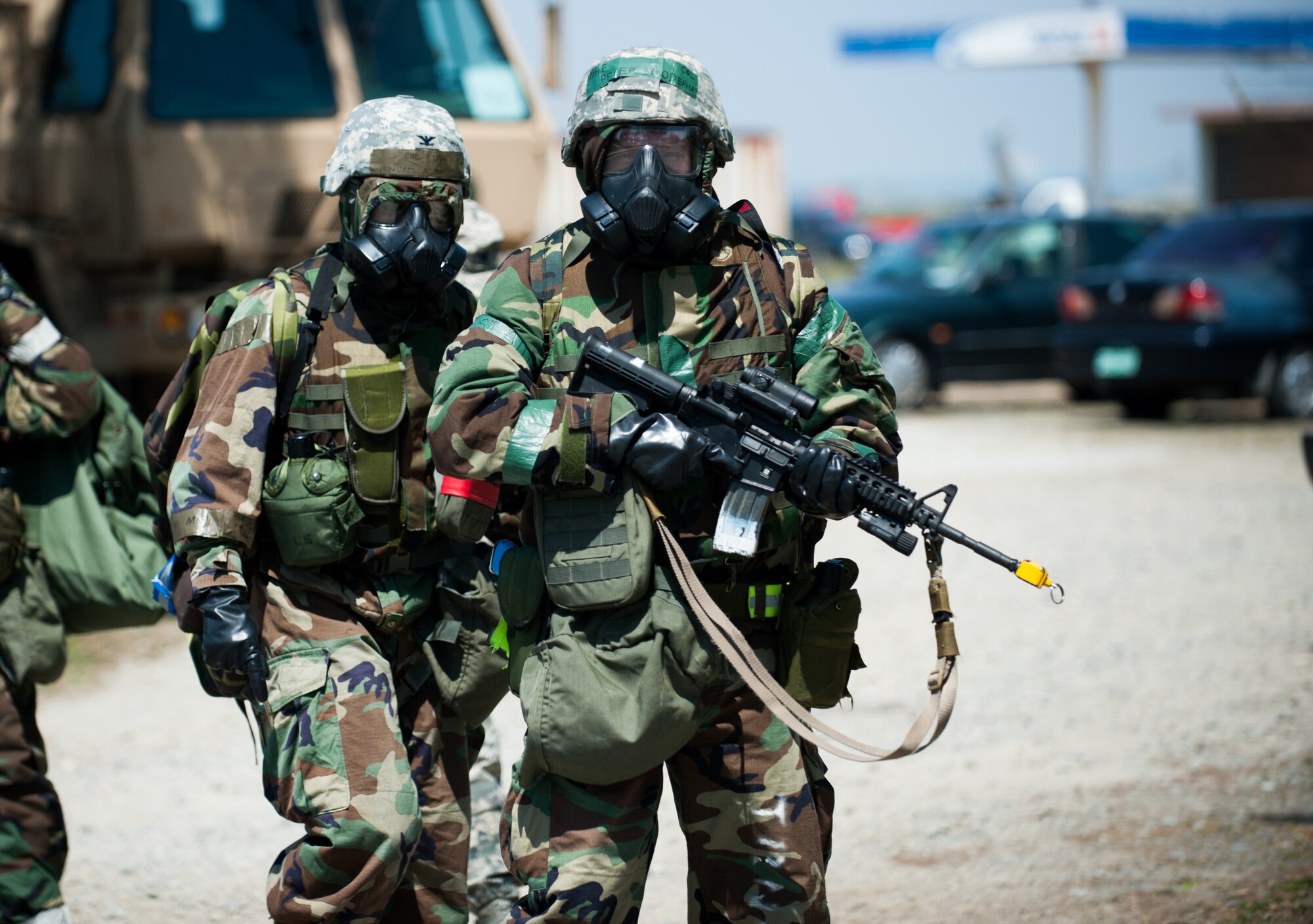 Col. Michael Morreale, 8th Maintenance Group commander, left, and Col. Peter Bilodeau, 8th Operations Group commander, evacuate a building after a simulated attack during exercise Beverly Bulldog 14-2 at Kunsan Air Base, Republic of Korea, May 7, 2014. The Wolf Pack continued to prove its combat readiness as they entered the third day of the peninsula-wide operational readiness exercise. (U.S. Air Force photo by Staff Sgt. Clayton Lenhardt/Released)