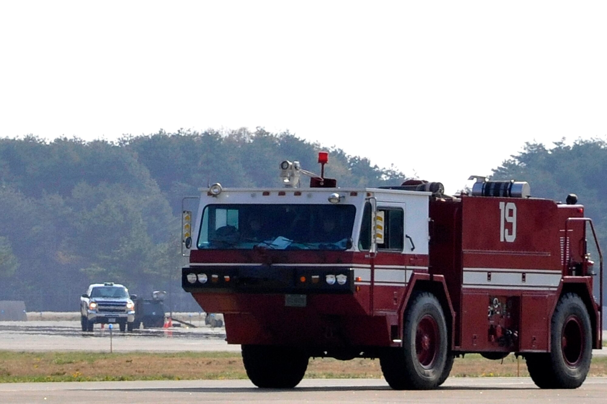 A fire truck from the 35th Civil Engineer Squadron arrives on scene after receiving a call that approximately 600 gallons of fuel had leaked from a tanker during Phase II of an Operational Readiness Exercise at Misawa Air Base, Japan, May 7, 2014. The fuel leak was an inject scenario created to test the fire department’s response time during the ORE. (U.S. Air Force photo/Airman 1st Class Patrick Ciccarone)