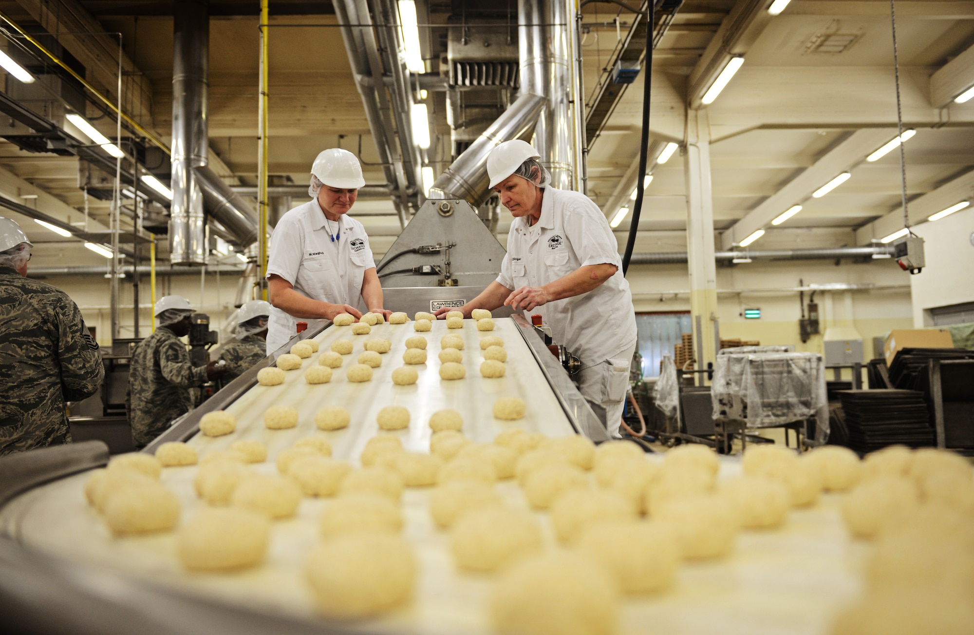 Tortilla dough rolls down the production line at the Army and Air Forces Exchange Service bakery plant in Gruenstadt, Germany April 30, 2014. The Gruenstadt facility is the central production location for more than 250 line items, as well as cold storage for 200 line items and even produces five million gallons of Culligan bottled water each year. The plant distributes to more than 100 locations in 25 countries and has been in business since 1953. (U.S. Air Force photo/ Staff Sgt. Ryan Crane)