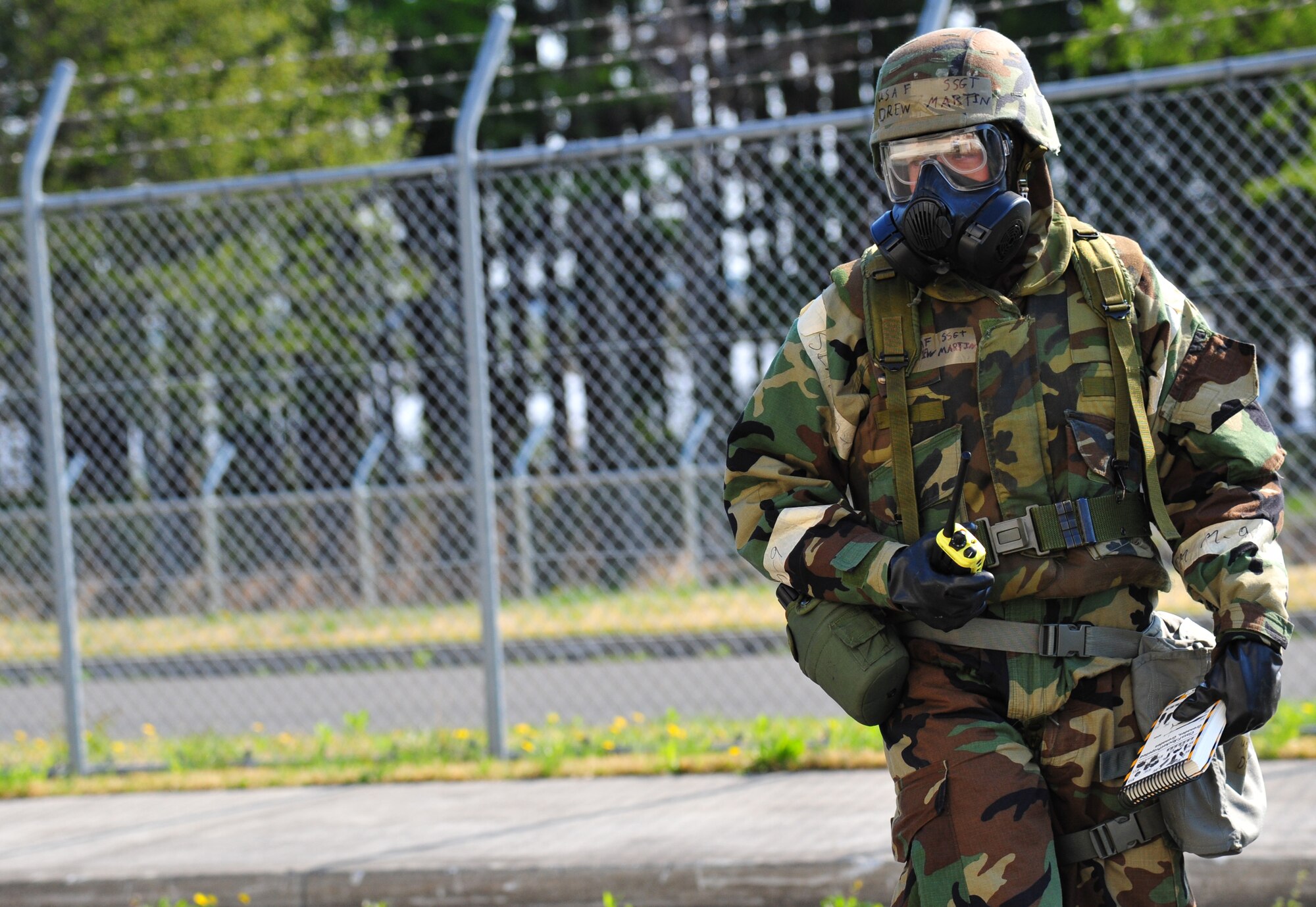 U.S. Air Force Staff Sgt. Drew Martin, 35th Communications Squadron base equipment control officer, conducts a post attack reconnaissance sweep at Misawa Air Base, Japan, May 7, 2014. Martin assessed status of the area by checking for unexploded ordnance, chemical agents, infrastructure damage, or injured personnel. (U.S. Air Force photo/Senior Airman Jose Hernandez-Domitilo)