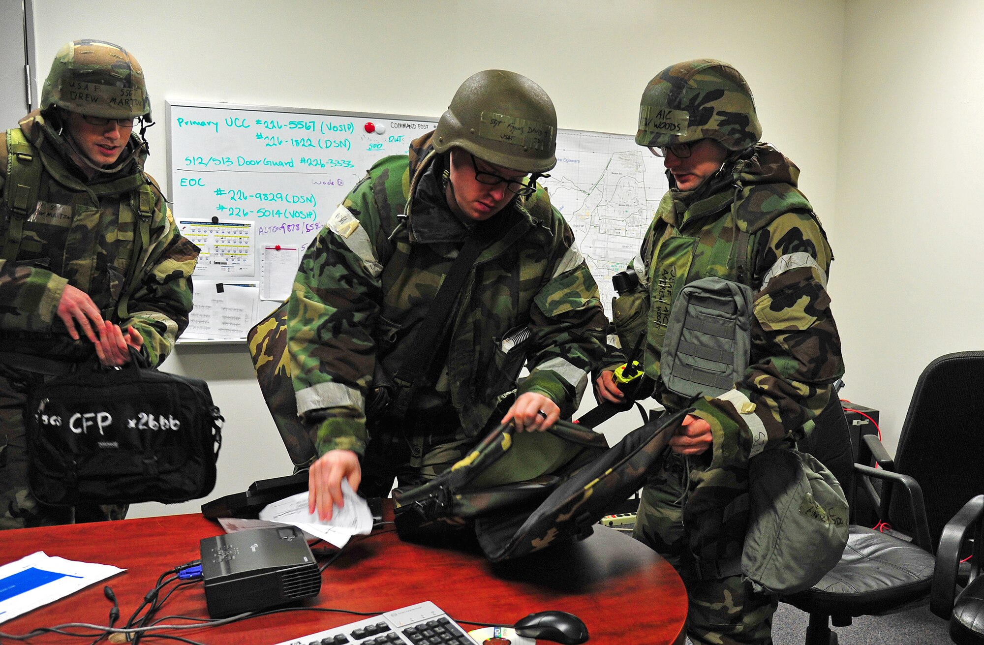 35th Communications Squadron Airmen pack essential equipment necessary after being notified about the possibility of evacuating their premise during an Operational Readiness Exercise at Misawa Air Base, Japan, May 7, 2014. The team packs equipment like crypto ignition keys, secret internet protocol router hard drives, radios, and accountability cards among other items. (U.S. Air Force photo/Senior Airman Jose Hernandez-Domitilo)