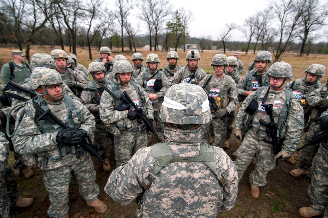 A safety officer briefs competitors before the 2014 Best Warrior competition for the 412th and 416th Theater Engineer commands on Fort McCoy, Wis., April 29, 2014. The four-day event tests a range of skills, including land navigation, weapons familiarization and physical fitness.
