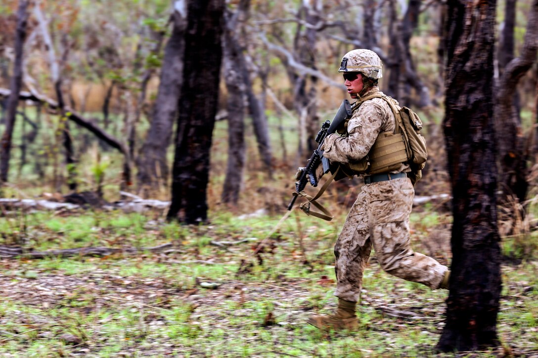 U.S. Marine Corps Lance Cpl. Alfonso Navarro moves through the woods toward his next objective during a live-fire exercise on Kangaroo Flats Training Area in Darwin, Australia, May 1, 2014. Navarro, an infantryman, is assigned to Bravo Company, 1st Battalion, 5th Marine Regiment, Marine Rotational Force Darwin.