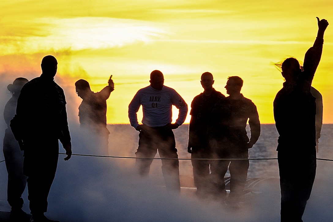 U.S. Navy sailors aboard the aircraft carrier USS Theodore Roosevelt perform practice catapult launches on the flight deck in the Atlantic Ocean, Aug. 25, 2013. The Roosevelt is underway for the first time in four years, conducting sea trials.  
