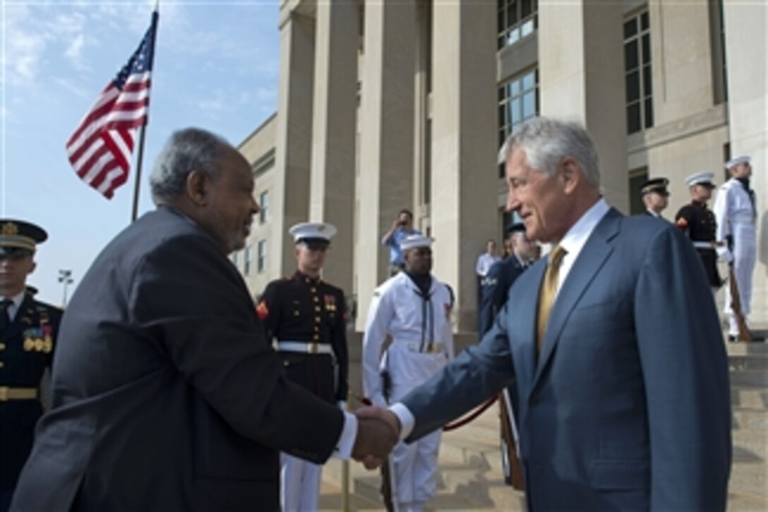 U.S. Defense Secretary Chuck Hagel, right, greets Djiboutian President Ismail Omar Guelleh before an honor cordon at the Pentagon, May 7, 2014. The two leaders met to discuss issues of mutual importance.