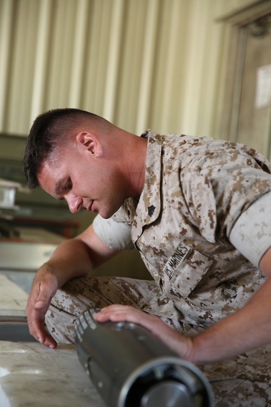 Sgt. Jason Connolly, an aviation ordnance systems technician with Marine Aviation Logistics Squadron 14, inspects the guidance control system portion of a captive air training missile May 5, at Marine Corps Air Station Cherry Point. Connolly recently won the Marine Corps Aviation Association’s ordnance Marine of the Year Award and the East Coast Aviation Ordnance Man of the Year Award.