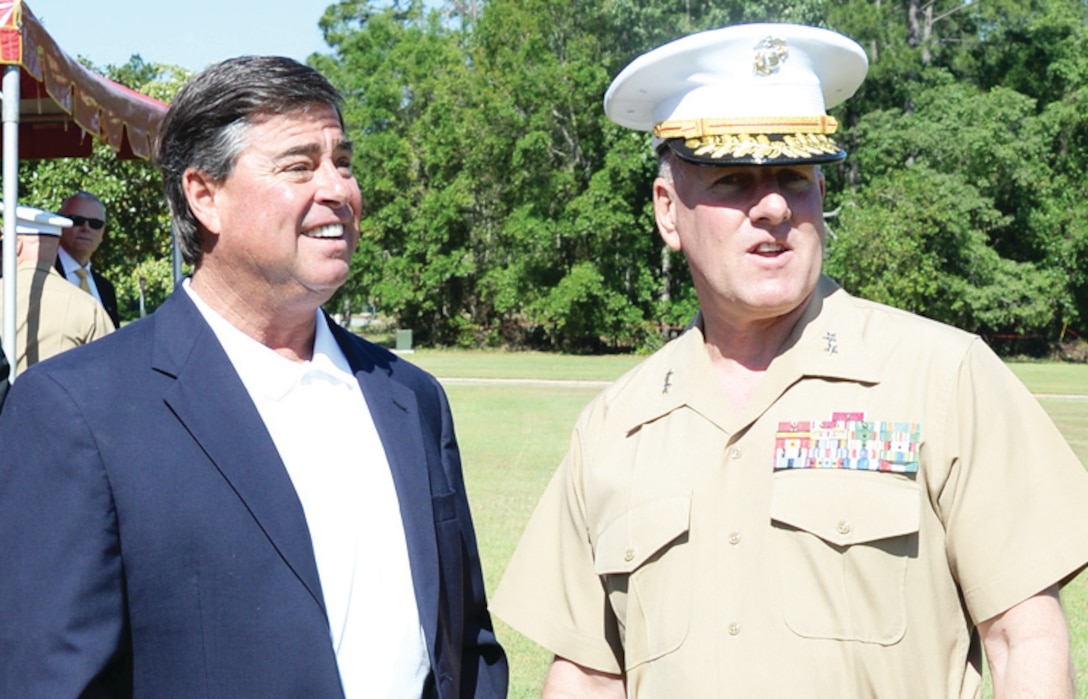 Maj. Gen. John J. Broadmeadow, commanding general, Marine Corps Logistics Command, and Jeff Sinyard, commission chairman, Dougherty County, engage in discussion after a ceremony aboard Marine Corps Logistics Base Albany, May 6, 2014. LOGCOM was the recipient of the Meritorious Unit Commendation.