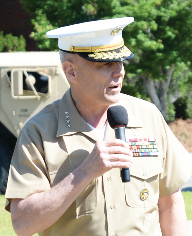 Gen. John M. Paxton Jr., assistant commandant of the Marine Corps, congratulates Marine Corps Logistics Command, recipient of the Meritorious Unit Commendation. The award was presented in a ceremony aboard Marine Corps Logistics Base Albany, Tuesday.   