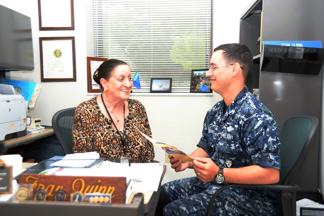 Frances Quinn, TRICARE health benefits adviser at Naval Branch Health Clinic Albany, provides a patient with information on TRICARE claim options at the clinic, recently. Quinn, a civil service employee for more than 50 years, is one of about 650 men and women who serve as civilian staff throughout Naval Hospital Jacksonville and five branch health clinics located across Florida and Georgia.