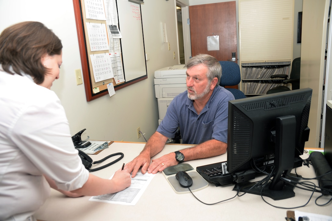 Rex Pate, a civil service occupational health file technician at Naval Branch Health Clinic Albany, provides appointment check-in assistance to a patient at the clinic. Naval Hospital Jacksonville Commanding Officer Capt. Gayle Shaffer,     proclaimed Public Service Recognition Week, which began Sunday and ends Saturday, to recognize each of the command’s six facilities across Florida and Georgia.