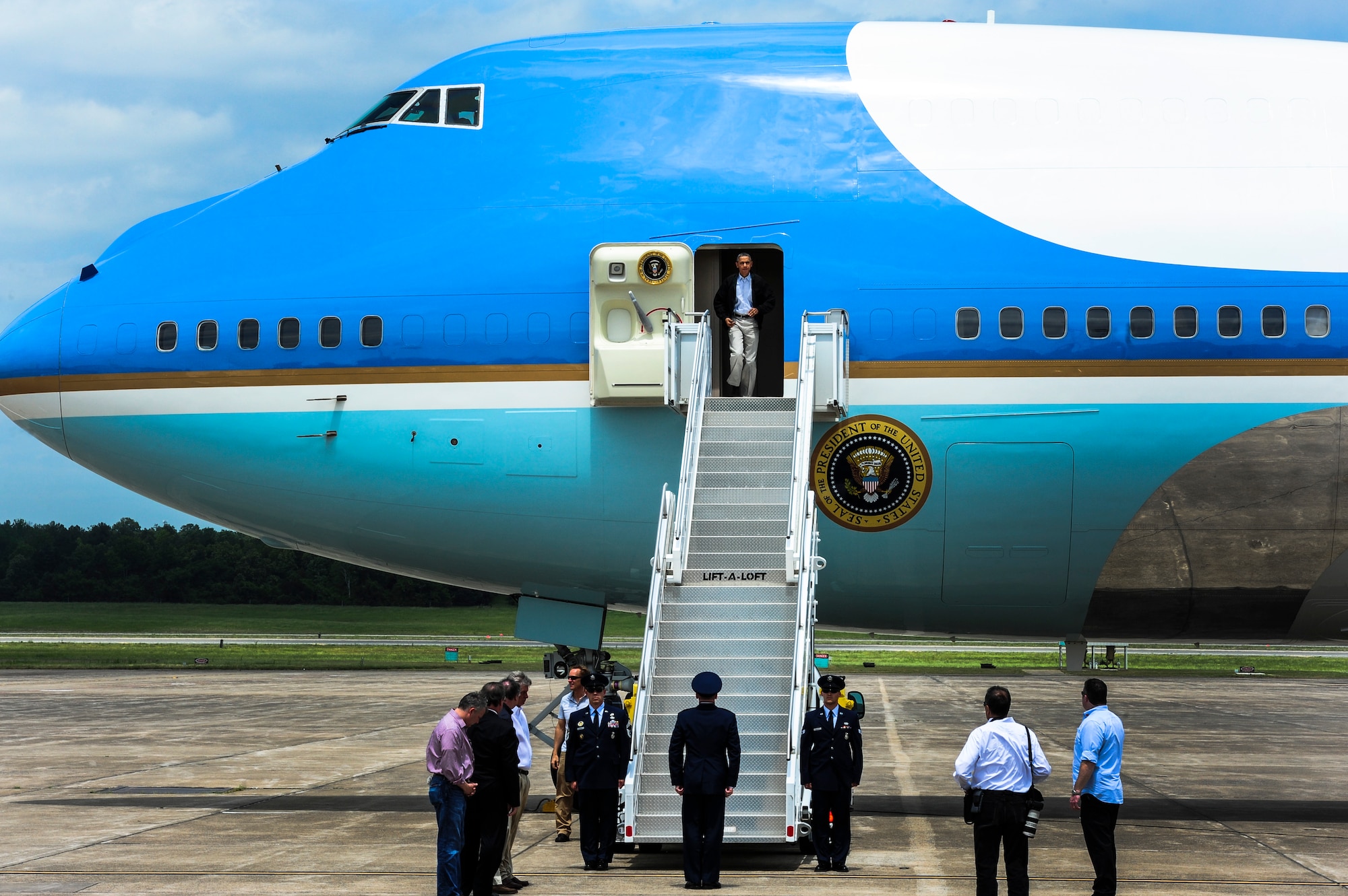 President Barack Obama steps off of Air Force One May 7, 2014, at Little Rock Air Force Base, Ark. President Obama visited with victims, local officials and emergency responders in Vilonia who were affected by the tornado on April 27. (U.S. Air Force photo/Senior Airman Kaylee Clark)
