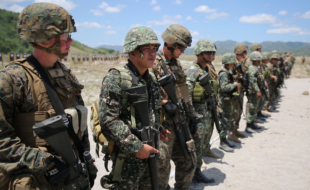 Philippine Marines assigned to 2nd Marine Company, 11th Marine Battalion, and U. S. Marines assigned to Charlie Company, 1st Battalion, 8th Marine Regiment, site in their weapons during close-quarter marksmanship bilateral training May 6, 2014, at Crow Valley, Philippines, for Balikatan 2014. This marks the first day of several bilateral live-fire training evolutions for the exercise. Balikatan is an annual training exercise that strengthens the interoperability between the Armed Forces of the Philippines and U.S. military in their commitment to regional security and stability, humanitarian assistance and disaster relief.