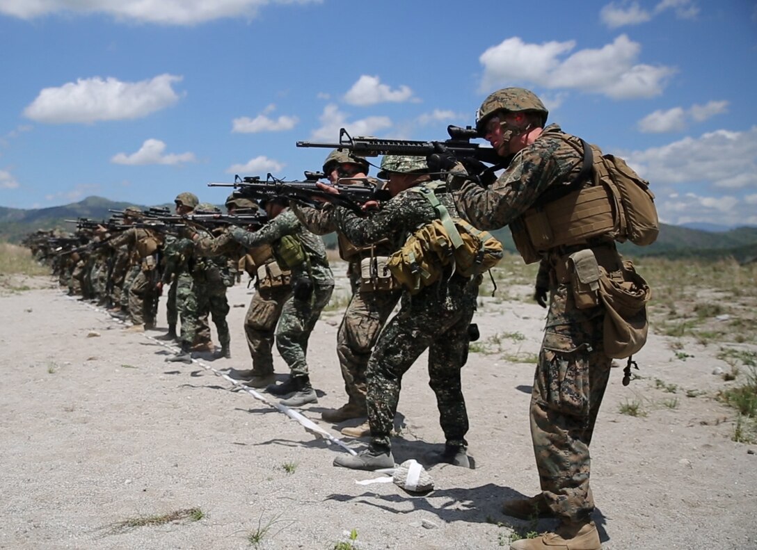 Philippine Marines assigned to 2nd Marine Company, 11th Marine Battalion, and U. S. Marines assigned to Charlie Company, 1st Battalion, 8th Marine Regiment, site in their weapons during close-quarter marksmanship bilateral training May 6, 2014, at Crow Valley, Philippines, for Balikatan 2014. This marks the first day of several bilateral live-fire training evolutions for the exercise. Balikatan is an annual training exercise that strengthens the interoperability between the Armed Forces of the Philippines and U.S. military in their commitment to regional security and stability, humanitarian assistance and disaster relief. 