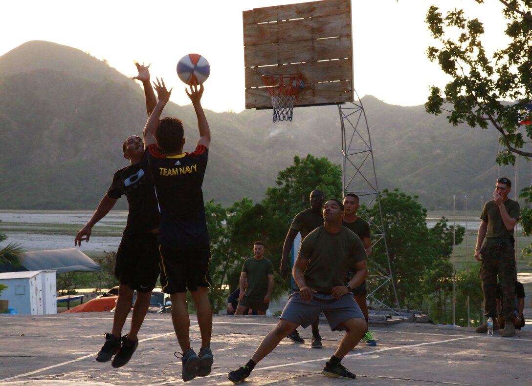 Members of the Philippine Air Force and U.S. Marine Corps compete in a friendly basketball match at Crow Valley, Philippines, May 5, 2014, to mark the end of the opening day of Balikatan 2014. Balikatan is an annual training exercise that strengthens the interoperability between the Armed Forces of the Philippines and U.S. military in their commitment to regional security and stability, humanitarian assistance and disaster relief.