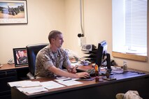 SSgt. Jason Kiernan, an East Hartford, Conn., native and the acting executive officer of Combat Logistics Battalion 2, Combat Logistics Regiment 2, 2nd Marine Logistics Group, uses the executive officer’s desk during the battalion’s NCO day aboard Camp Lejeune, N.C., May 6, 2014. NCOs with proven leadership abilities were selected to fill command positions across the battalion to empower them to set the standard and lead the battalion for a day. (U.S. Marine Corps photo by Cpl. Shawn Valosin)