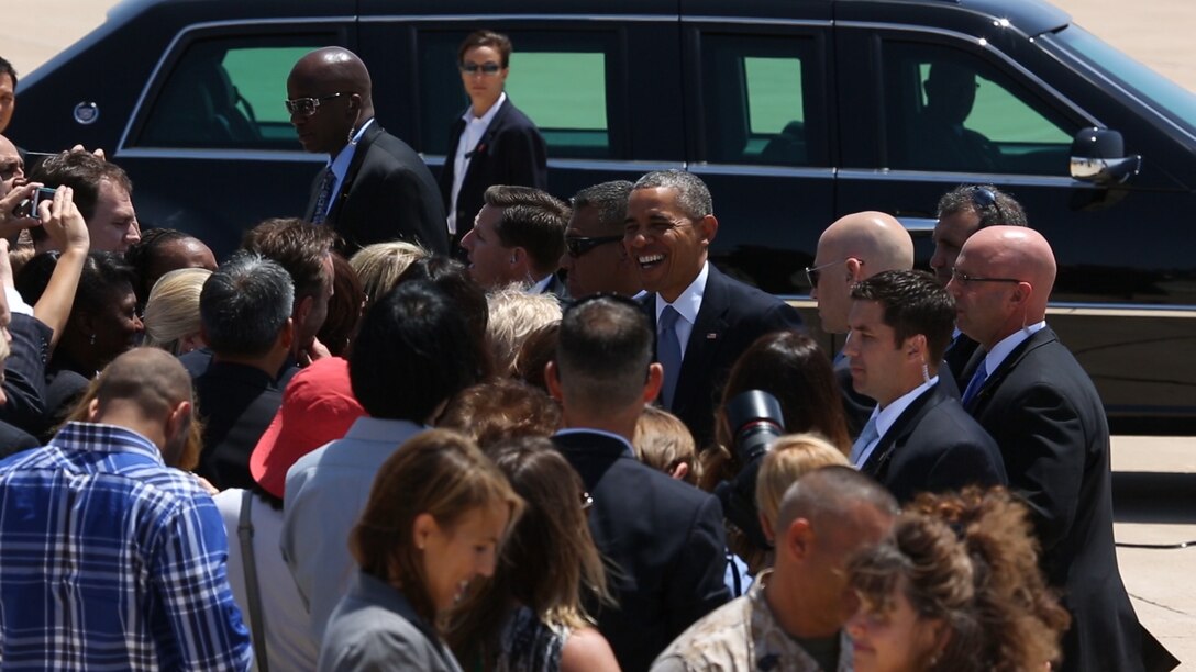 President Obama takes a moment to great the crowd at MCAS Miramar May 8, 2014. Obama came to San Diego for his fundraising event in La Jolla Calif. Obama arrived in Los Angeles May 7, as a part of  three-day trip to California to rais funds to help Democrats.